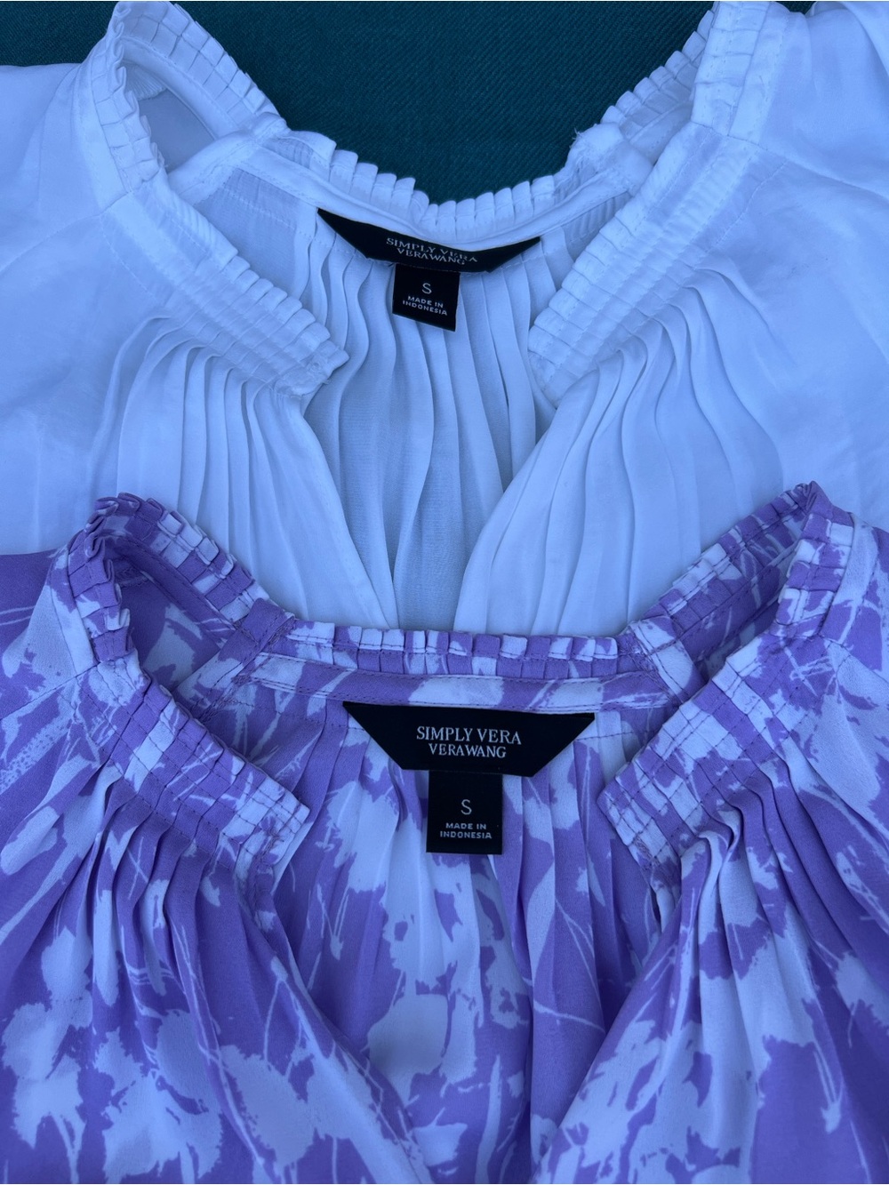 Sleeveless White V-Neck and Violet print V-neck tops. Sold as set of 2.